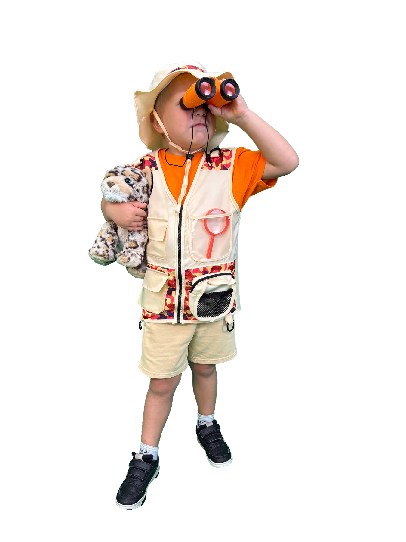 Ivan in his explorer outfit, looking through binoculars and holding Toby the Leopard
